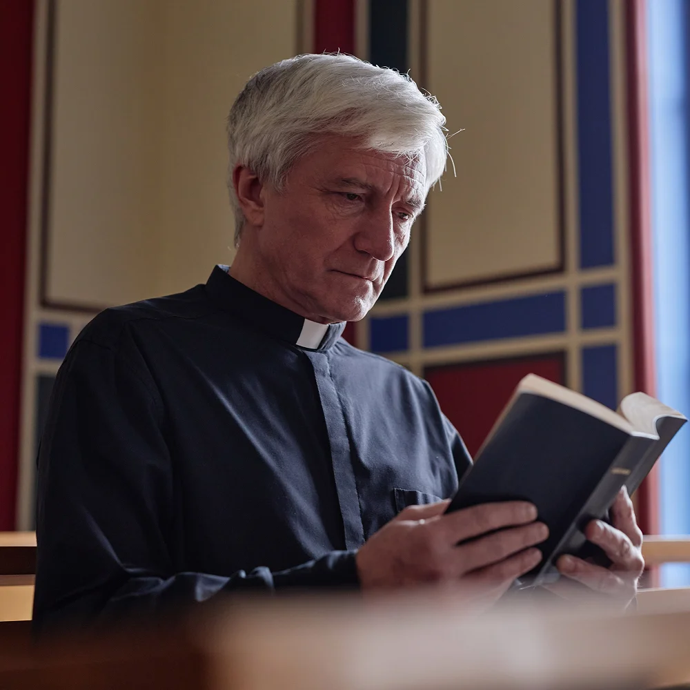 Pastor reading the Bible during a church ceremony